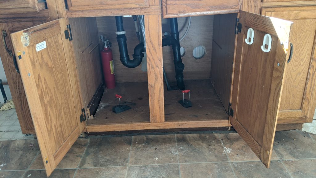 Mouse traps under kitchen sink