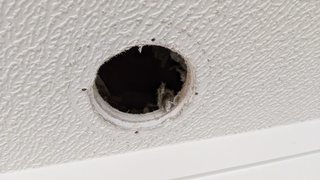 Hole in kitchen ceiling (close up)