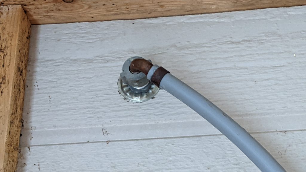 Master bedroom: shower hose connect close up